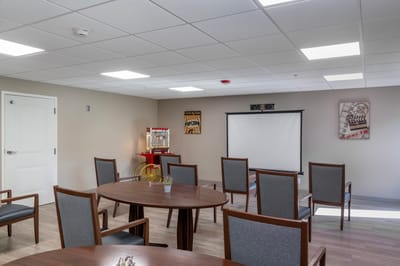 Bright activity room with tables and chairs