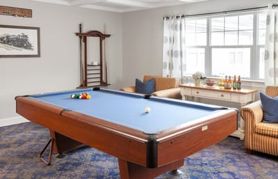 Interior common area with a pool table and seating