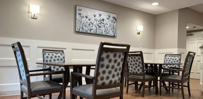 A cozy common area with seating and artwork