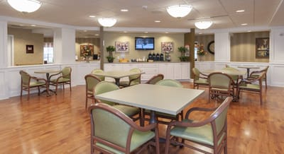 Interior view of a dining area with tables and chairs