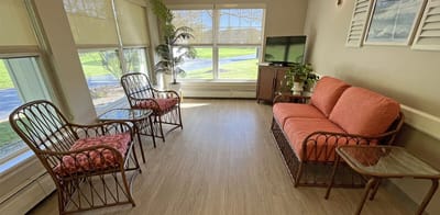 Cozy common area with seating and large windows