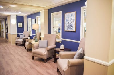 Bright hallway with comfortable seating and artwork