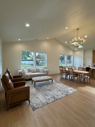 Bright common area with seating and dining table