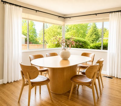 Bright common area with a dining table and chairs