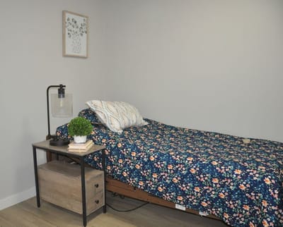 Cozy resident bedroom with floral bedding