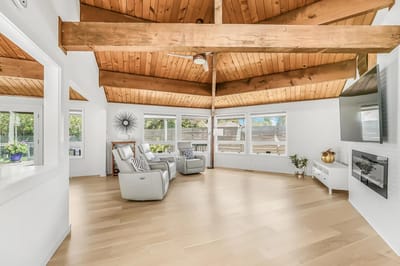 Bright and spacious interior with wooden beams and modern decor
