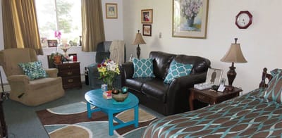 Cozy resident room with a seating area and decor