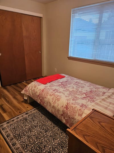 Cozy resident room with a bed and window