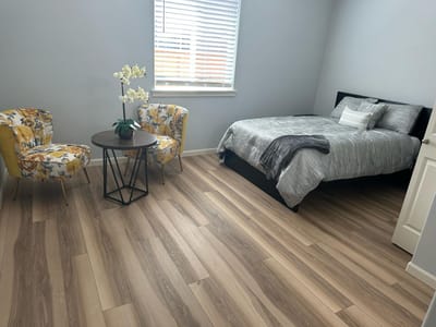 Cozy bedroom with seating area and floral decor