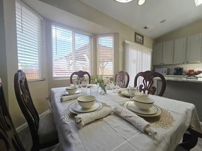 Dining table set for a meal in an inviting interior