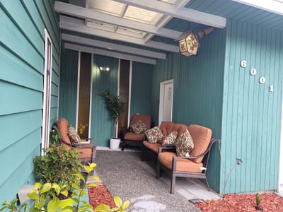 Cozy outdoor seating area with a decorative entrance