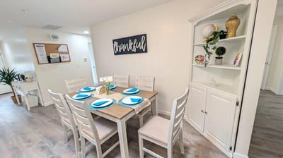 Bright and welcoming common area with dining table