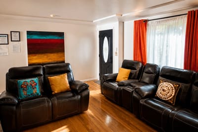 Cozy common area with comfortable seating and artwork