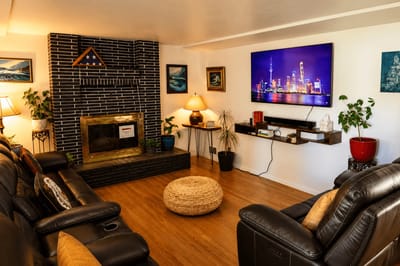 Cozy lounge area with seating and a fireplace