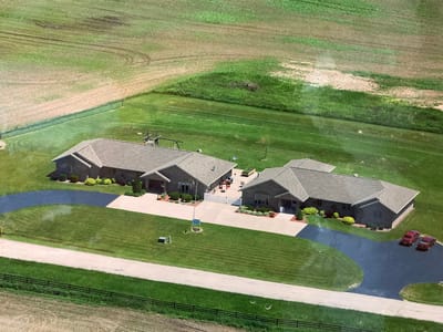 Aerial view of the facility with landscaped grounds