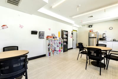 Common area with seating and recreational materials