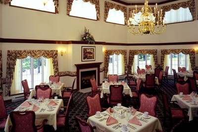 Elegant dining room with tables set for meals