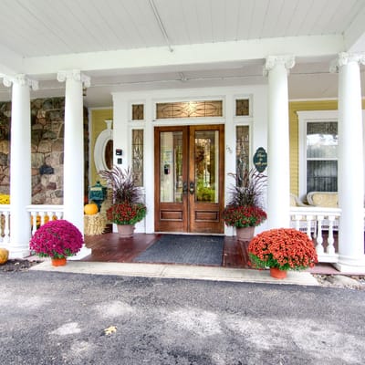 Front entrance with flowers and decor