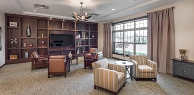 Comfortable lounge area with seating and decorative shelving
