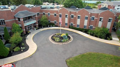 Aerial view of the facility entrance with landscaped grounds
