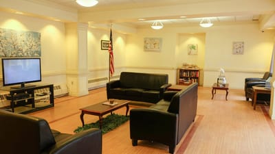 Interior view of a cozy common area with seating