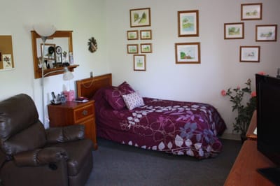 Cozy resident room with personal touches and decor