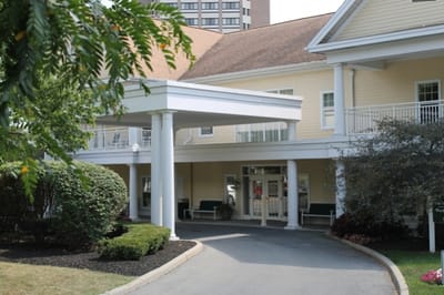 Entrance of a senior living facility with covered walkway