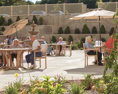 Residents enjoying time outdoors in a garden area