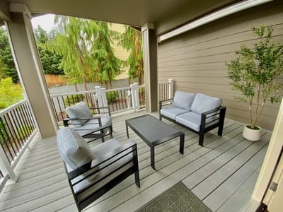 Outdoor seating area with chairs and a small table