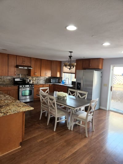 Bright dining area with wooden table and chairs