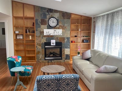 Cozy common area with a fireplace and seating
