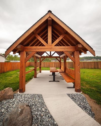 Outdoor covered seating area with wooden structure