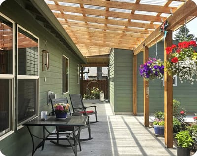 Outdoor patio area with furniture and flowers