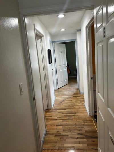 View down a well-lit hallway in the facility.