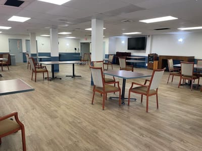 Spacious dining room with tables and chairs