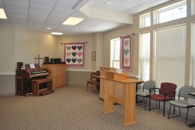 Interior common area with piano and seating