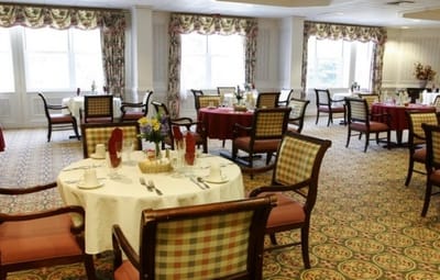 Dining room setup with tables and decorations
