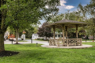 A gazebo in a green outdoor space