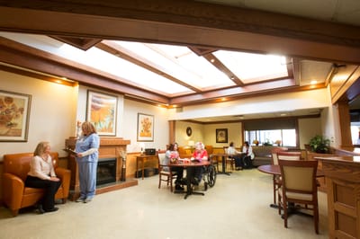 Residents and staff interacting in a common area