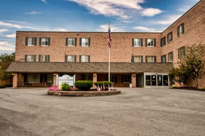 Exterior view of Absolut Center building with landscaping