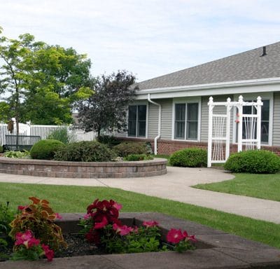 Outdoor view of the facility with garden and entrance