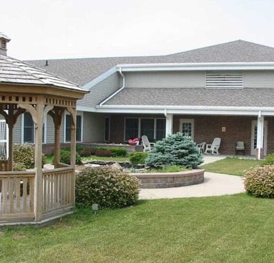 Exterior view of Father Baker Manor with gazebo and landscaping