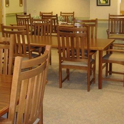 Dining room area with wooden tables and chairs