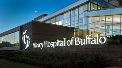 Exterior view of Mercy Hospital of Buffalo at dusk