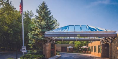 Entrance to Seneca Health Care Center with awning and trees