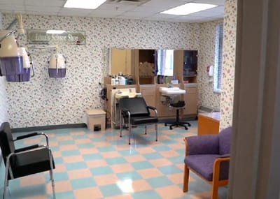 Facility hair salon with styling stations and chairs