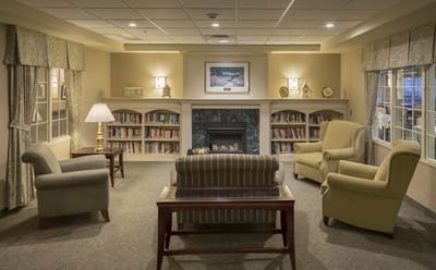 Cozy lounge area with bookshelves and seating