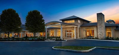 Front entrance of Maplewood Nursing Home at sunset