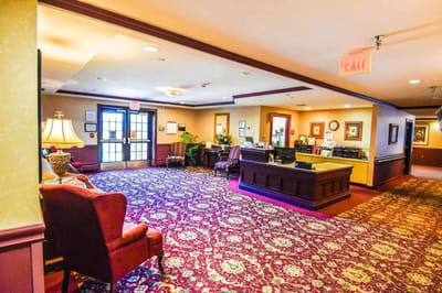 Interior view of a common area with seating and reception desk