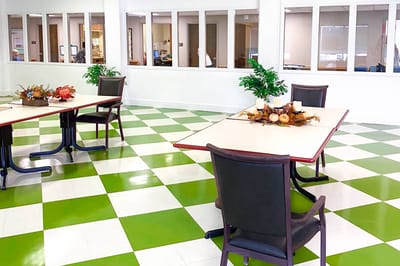 Sunny interior of a common area with green and white floors